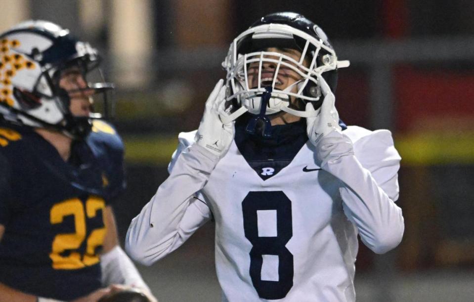 Redwood’s Isaiah Galaviz, right, shows frustration after Sunnyside quarterback Tanner Wilson, left, scored a touchdown at the start of the third quarter in the Central Section D2 playoff game Friday, Nov. 3, 2023 in Fresno. Sunnyside won the game 39-21.