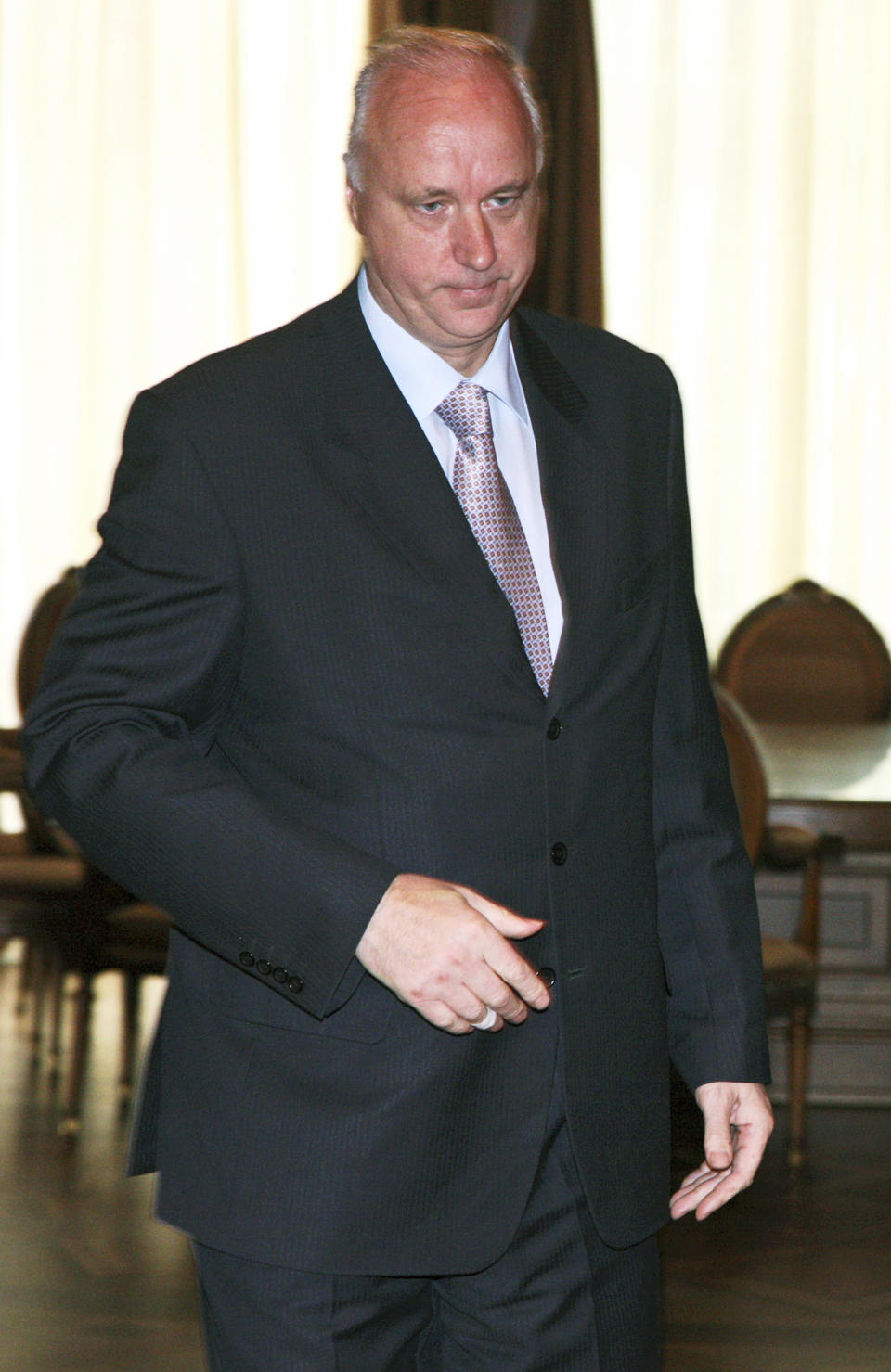 FILE In this Sunday, Aug. 10, 2008 file photo, Alexander Bastrykin, head of the prosecutors' Investigative Committee, walks during a meeting in the Moscow Kremlin. Dmitry Muratov, the editor of Novaya Gazeta where Anna Politkovskaya worked before her 2006 murder, said Wednesday, June 13, 2012, in an open letter to Investigative Committee chief Alexander Bastrykin that he should offer security guarantees to reporter Sergei Sokolov. Muratov said that Bastrykin was angered by a Novaya Gazeta article that accused him of failing to punish the perpetrators of a 2010 killing of 12 people, including four children, by a gang in southern Russia. (AP Photo/ RIA Novosti, Presidential Press Service, file)