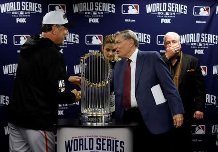 San Francisco Giants manager Bruce Bochy (left) shakes hands with MLB commissioner Bud Selig after game seven of the 2014 World Series against the Kansas City Royals at Kauffman Stadium. Charlie Neibergall/Pool Photo via USA TODAY Sports