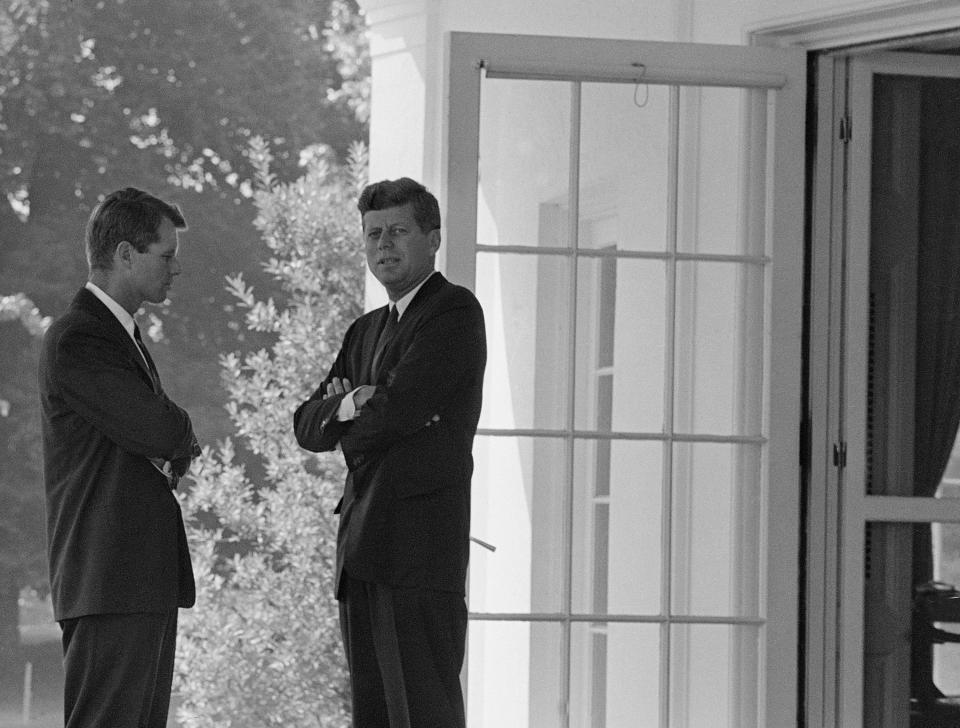 U.S. President John F. Kennedy, right, confers with his brother Attorney General Robert F. Kennedy at the White House in Washington, D.C., on Oct. 1, 1962 during the buildup of military tensions between the U.S. and the Soviet Union that became Cuban missile crisis later that month.  (AP Photo)