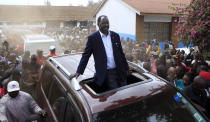 <p>Kenyan Opposition leader Raila Odinga drives passing his supporters after casting his vote in Kibera slums in Nairobi,Kenya, Tuesday, Aug. 8, 2017. (Photo: Noor Khamis/AP) </p>