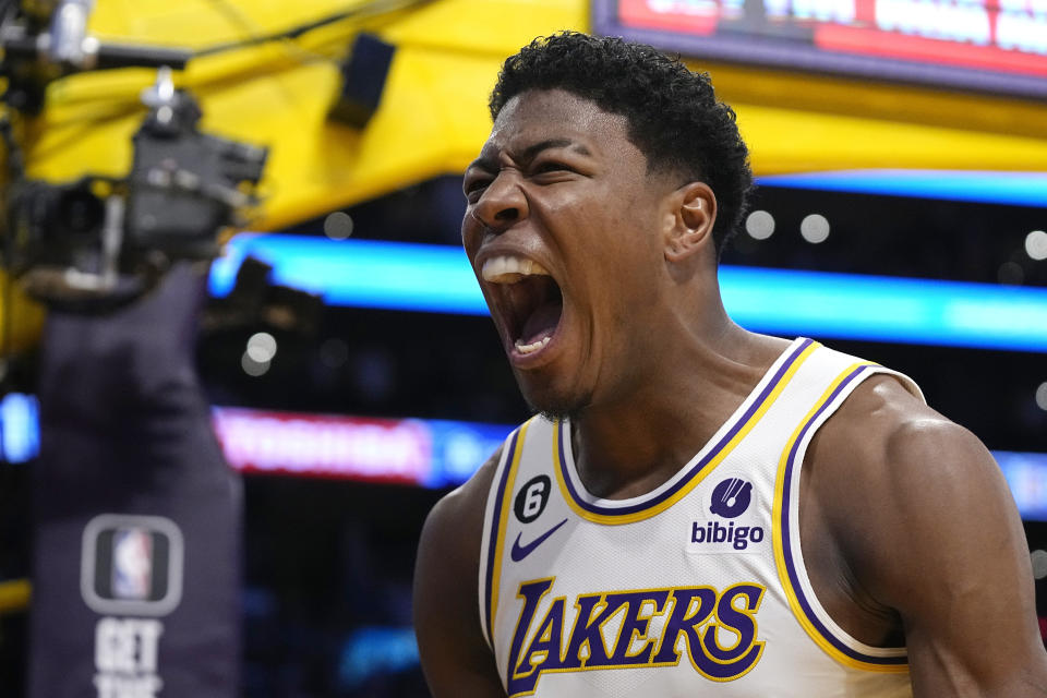Los Angeles Lakers forward Rui Hachimura, left, celebrates after dunking during the first half in Game 3 of a first-round NBA basketball playoff series against the Memphis Grizzlies Saturday, April 22, 2023, in Los Angeles. (AP Photo/Mark J. Terrill)