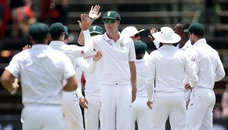 South Africa's Morne Morkel (C) celebrates with team mates the dismissal of England's Alex Hales after he was caught out by AB de Villiers during the third cricket test match in Johannesburg, South Africa, January 15, 2016. REUTERS/Siphiwe Sibeko