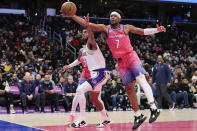 Washington Wizards guard Jordan Goodwin, right, steals the ball from Los Angeles Lakers forward Troy Brown Jr., left, during the first half of an NBA basketball game, Sunday, Dec. 4, 2022, in Washington. (AP Photo/Jess Rapfogel)