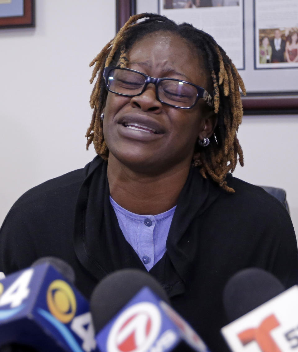 Gina Alexis, mother of 14-year-old Nakia Venant, who livestreamed her suicide on Facebook over the weekend, weeps as she answers a question during a news conference, Wednesday, Jan. 25, 2017, shows a in Plantation, Fla. Nakia Venant's suicide is at least the third to be livestreamed nationally in the last month. (AP Photo/Alan Diaz)