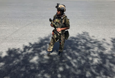 A member of the Afghan security forces keeps watch at the site of an attack in Kabul, Afghanistan August 21, 2018. REUTERS/Mohammad Ismail