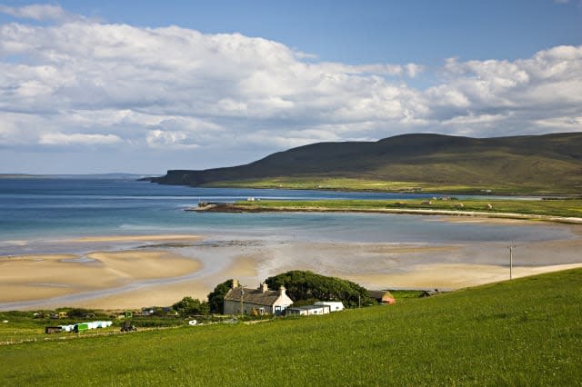 Scapa Flow and the Orkney Island of Hoy showing beaches, hills and fields in bright sunshine, Scotland