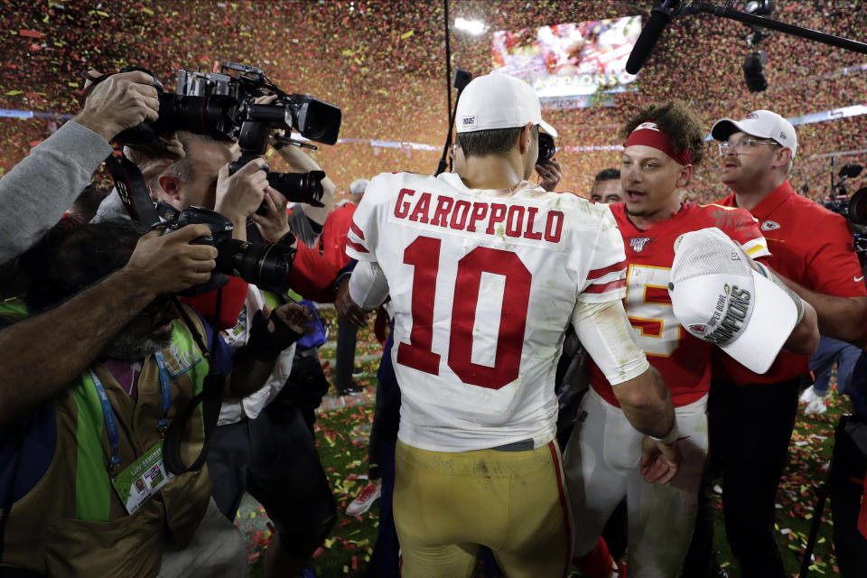 Kansas City Chiefs' quarterback Patrick Mahomes, right, speaks to San Francisco 49ers' quarterback Jimmy Garoppolo after winning the NFL Super Bowl 54 football game Sunday, Feb. 2, 2020, in Miami Gardens, Fla. (AP Photo/Matt York)