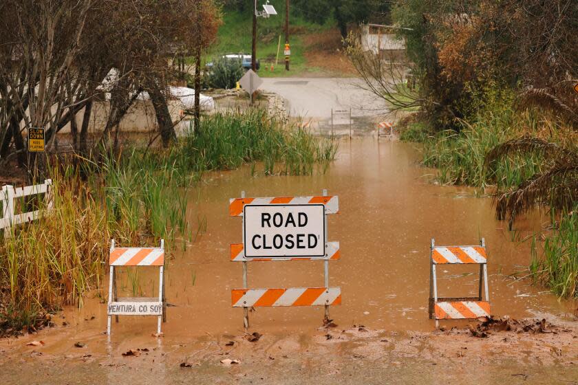 Ventura, CA - February 04: Flooding is seen along Camp Chafee Road at Casitas Vista Road on Sunday, Feb. 4, 2024 in Ventura, CA. Officials across Southern and Central California are urgently warning residents to prepare as a storm system fueled by an atmospheric river brings heavy rainfall. (Dania Maxwell / Los Angeles Times)