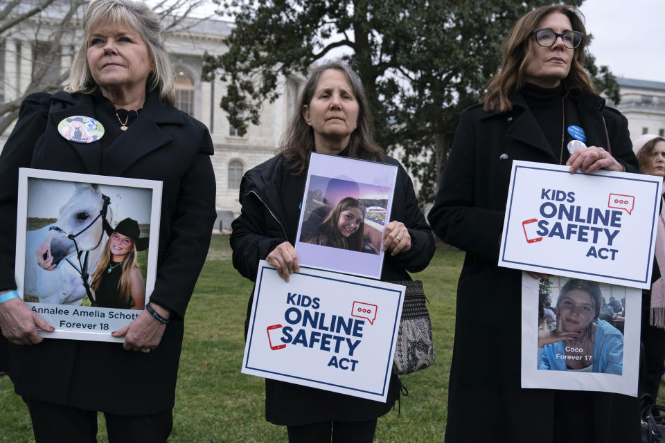 Family members holds a photographs of their loved ones during a rally to protect kids online on Capitol Hill in Washington, Wednesday, Jan. 31, 2024. (AP Photo/Jose Luis Magana)