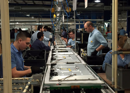 Employees work at BGH SA electronics and appliances manufacturing plant in Rio Grande, Tierra del Fuego, Argentina July 26, 2017. REUTERS/Miguel Lo Bianco