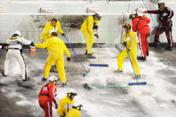 DAYTONA BEACH, FL - FEBRUARY 27: Safety workers clean up the track after a jet dryer burst into flames after being hit under caution by Juan Pablo Montoya, driver of the #42 Target Chevrolet, during the NASCAR Sprint Cup Series Daytona 500 at Daytona International Speedway on February 27, 2012 in Daytona Beach, Florida. (Photo by John Harrelson/Getty Images for NASCAR)