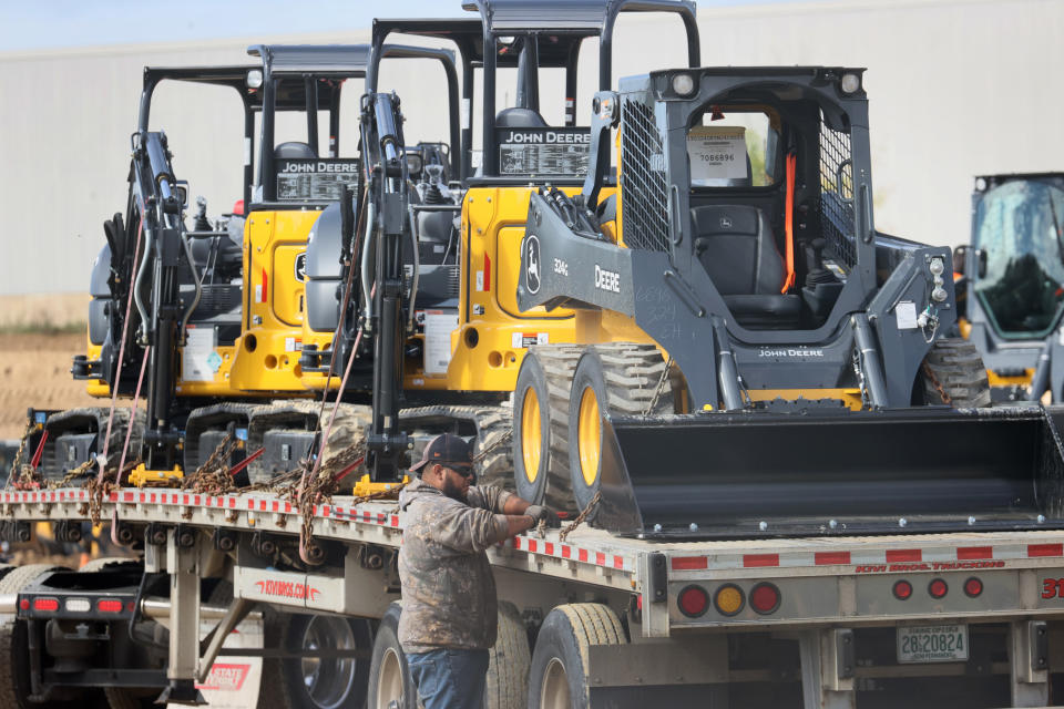 DUBUQUE, IOWA - OCTOBER 15: Construction equipment manufactured by John Deere is loaded onto trucks at the John Deere Dubuque Works facility on October 15, 2021 in Dubuque, Iowa. More than 10,000 John Deere employees nationwide, represented by the UAW, walked off the job yesterday after failing to agree to the terms of a new contract.  (Photo by Scott Olson/Getty Images)