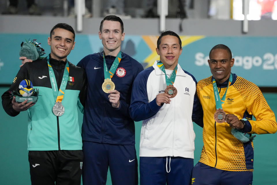 Medalists, from left, Mexico's Carlos Villareal, silver, Thomas Scott of the United States, gold, Guatemala's Allan Maldonado and Colombia's Juan Landazuri, bronze, pose at the podium of men's karate -75kg at the Pan American Games in Santiago, Chile, Sunday, Nov. 5, 2023. (AP Photo/Moises Castillo)