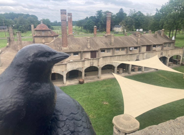 A raven overlooks the Tile Works in Doylestown, one of give castles in Bucks County.