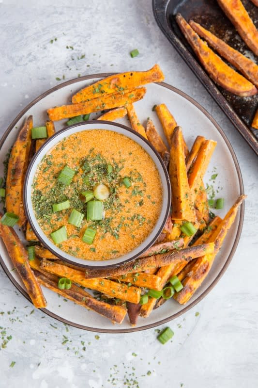 <p>The Roasted Root</p><p>Perfectly crispy baked sweet potato fries made with an easy chipotle dipping sauce is a winning Friendsgiving appetizer. </p><p><strong>Get the recipe: </strong><strong><a href="https://www.theroastedroot.net/crispy-baked-sweet-potato-fries-with-chipotle-dipping-sauce/" rel="nofollow noopener" target="_blank" data-ylk="slk:Crispy Sweet Potato Fries with Chipotle Dipping Sauce;elm:context_link;itc:0;sec:content-canvas" class="link ">Crispy Sweet Potato Fries with Chipotle Dipping Sauce</a></strong></p>