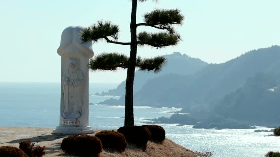 A penis statue stands on the cliff edge in Haesindang Park (Reuters)