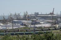 Train carriages for grain transport are parked in the Black Sea port of Constanta, Romania, Tuesday, June 21, 2022. While Romania has vocally embraced the ambitious goal of turning into a main hub for the export of agricultural products from Ukraine, economic experts and port operators in the country warn that it was much easier objective to set than to actually achieve. (AP Photo/Vadim Ghirda)