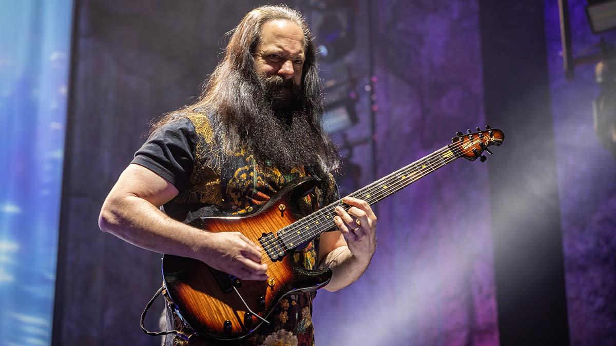  John Petrucci onstage in Norway with his signature Ernie Ball Music Man JP Series signature guitar. 