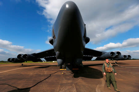 FILE PHOTO - Captain Andrew Paulsen walks in front of his U.S. Air Force B-52 during pre-flight checks at Royal Air Force (RAF) Fairford before a training mission in the United Kingdom's airspace, June 17, 2014. REUTERS/Andrew Winning/File Photo