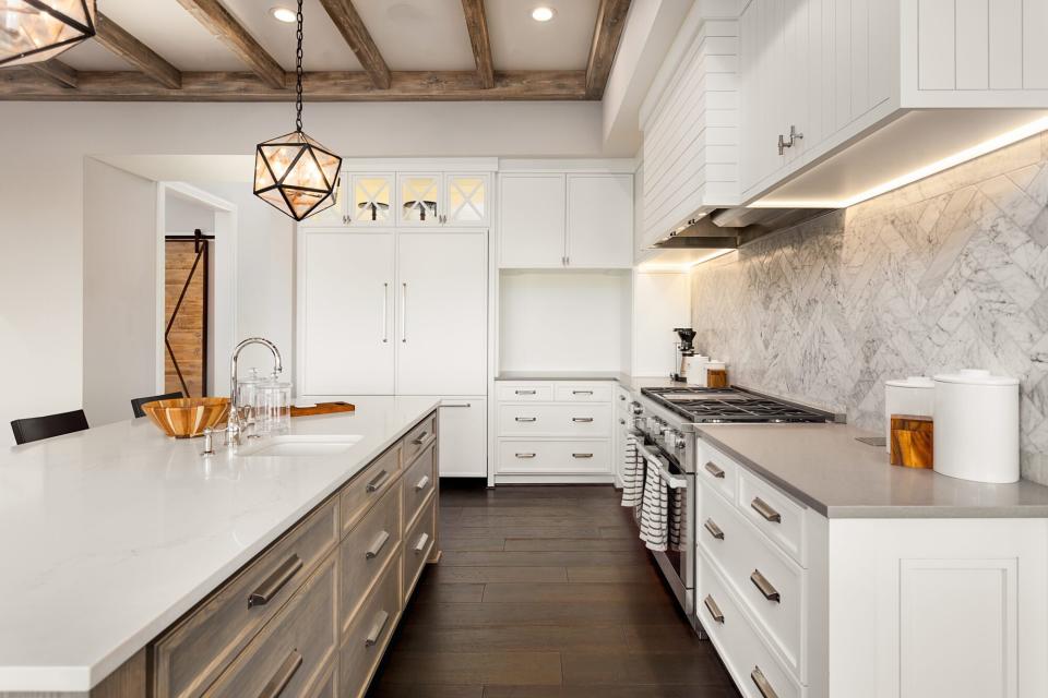 large kitchen island in modern white kitchen