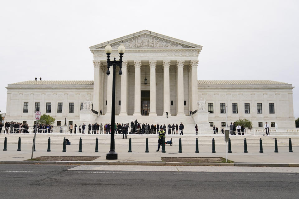 Supreme Court Associate Justice Ketanji Brown Jackson stands outside the Supreme Court, at the top of the steps, with Chief Justice of the United States John Roberts, following her formal investiture ceremony at the Supreme Court in Washington, Friday, Sept. 30, 2022. (AP Photo/Carolyn Kaster)