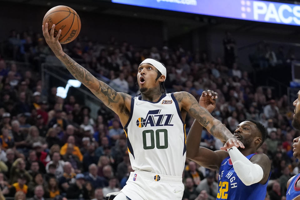 Utah Jazz guard Jordan Clarkson (00) goes to the basket as Denver Nuggets Jeff Green (32) defends in the second half during an NBA basketball game Tuesday, Oct. 26, 2021, in Salt Lake City. (AP Photo/Rick Bowmer)