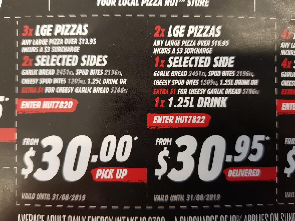 A Pizza Hut paper leaflet showing a $30 pick up and $30.95 delivery deals.