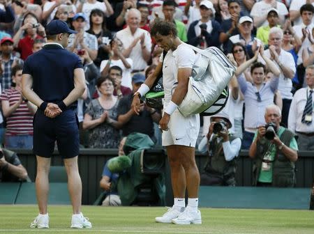 Rafael Nadal of Spain prepares to walk off court after losing his match against Dustin Brown of Germany at the Wimbledon Tennis Championships in London, July 2, 2015. REUTERS/Stefan Wermuth