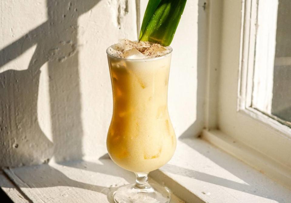 Muddy River Distillery’s Painkiller includes a pineapple leaf garnish.