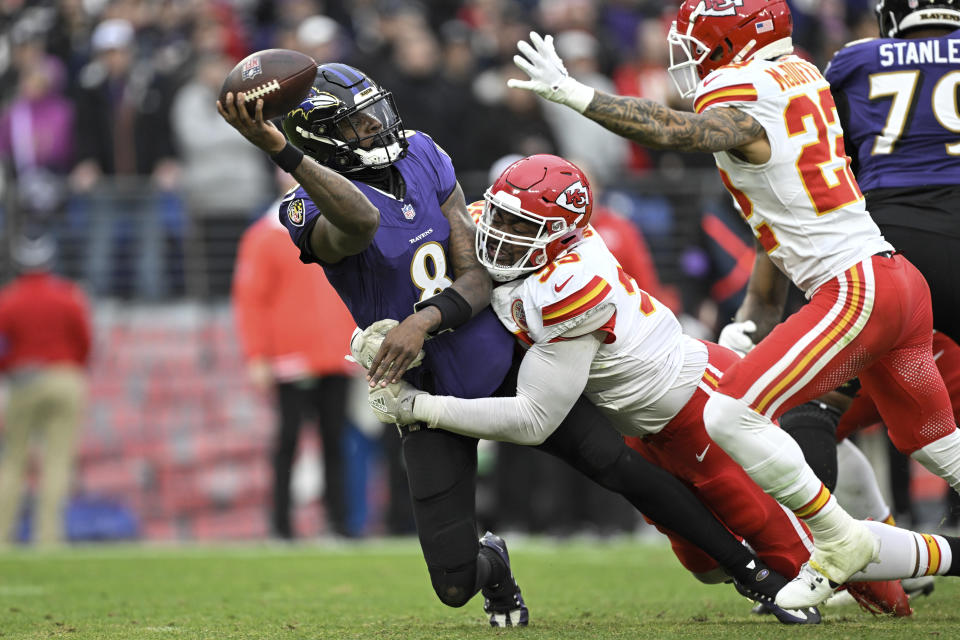 FILE - Baltimore Ravens quarterback Lamar Jackson (8) is pressured by Kansas City Chiefs defensive tackle Chris Jones during the first half of the AFC Championship NFL football game in Baltimore, Sunday, Jan. 28, 2024. Kirk Cousins, Chris Jones and Mike Evans are among the best players who will be available on the open market unless their teams use a franchise tag by March 5. They’ll be joined by running backs Derrick Henry, Saquon Barkley and Josh Jacobs, edge rushers Josh Allen, Brian Burns and Danielle Hunter and several other talented players.(AP Photo/Terrance Williams, File)