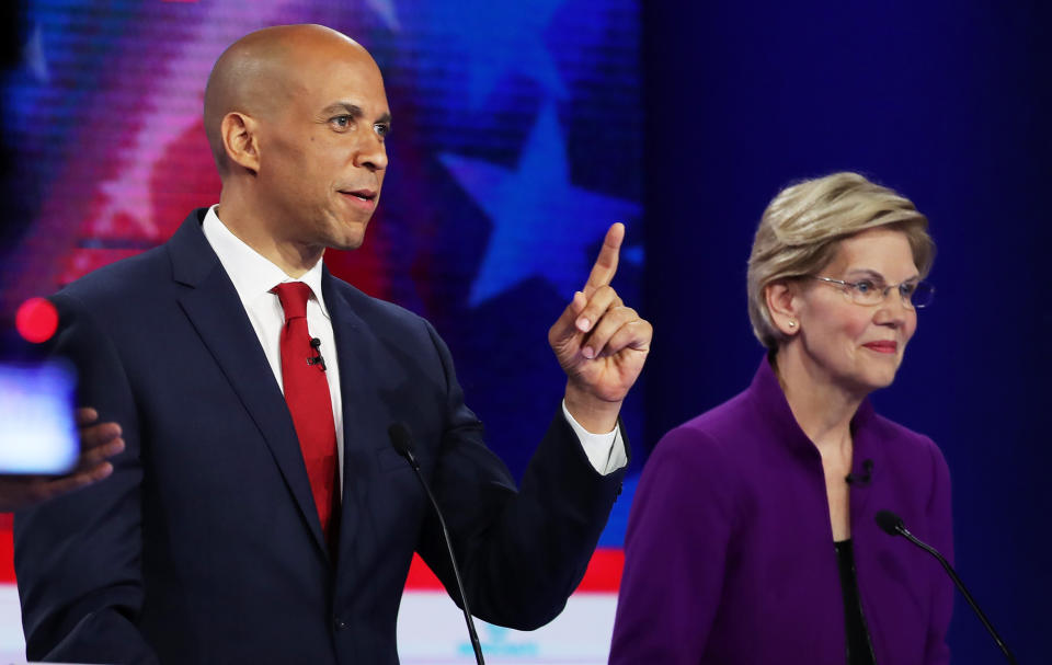 Sens. Cory Booker (D-N.J.) and Elizabeth Warren (D-Mass.) are among the 2020 presidential candidates to call for a national gun licensing system. (Photo: Getty Editorial)