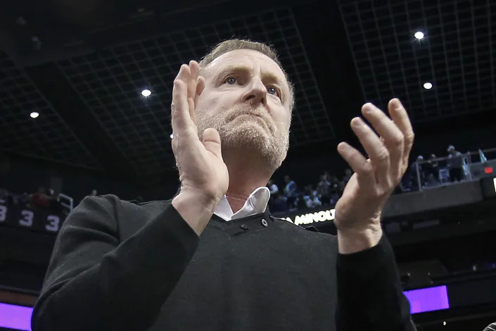 FILE - Phoenix Suns owner Robert Sarver applauds the teams 107-99 victory against the Minnesota Timberwolves during an NBA basketball game, Saturday, Dec. 15, 2018, in Phoenix. The NBA has suspended Phoenix Suns and Phoenix Mercury owner Robert Sarver for one year, plus fined him $10 million, after an investigation found that he had engaged in what the league called “workplace misconduct and organizational deficiencies.