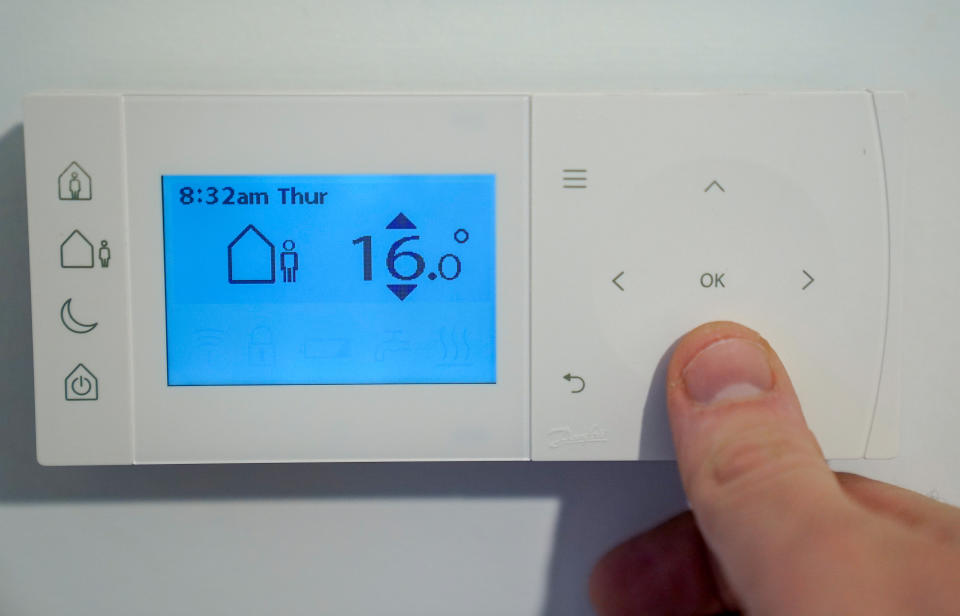 energy bills  A homeowner turns down the temperature of a central heating thermostat in Basingstoke, Hampshire. Ofgem is expected to announce that the energy price cap is to rise by 50 percent because of soaring wholesale gas prices, meaning the average bill could hit �1,915. Picture date: Thursday February 3, 2022.