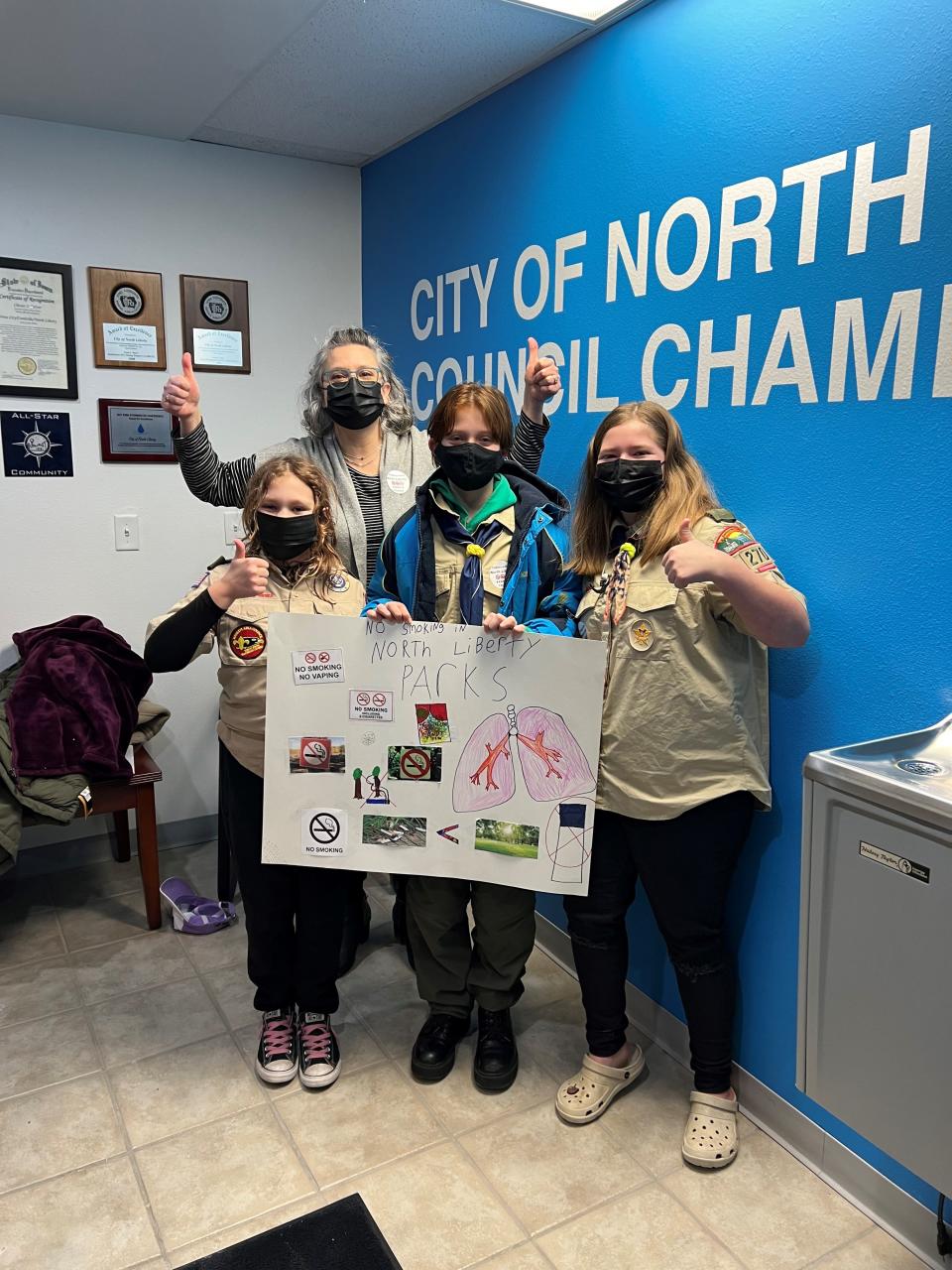 Susan Vileta and Cub Scout Troop 270 pose after presenting information about smoking in parks to the North Liberty Parks and Recreation Commission in January. The City Council passed an ordinance banning the practice in April.