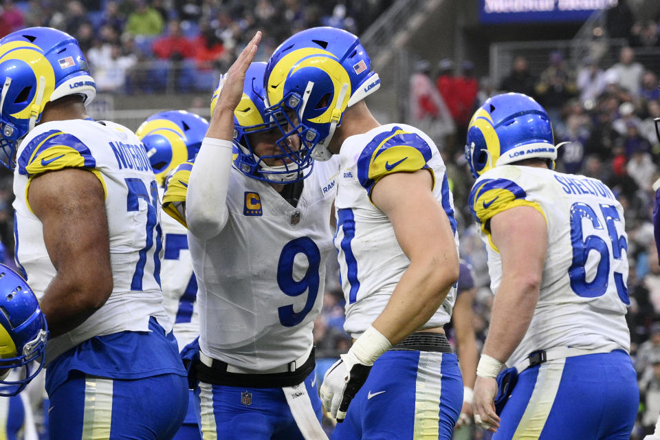 Los Angeles Rams quarterback Matthew Stafford (9) celebrates a touchdown by Rams tight end Davis Allen, second from right, during the first half of an NFL football game against the Baltimore Ravens Sunday, Dec. 10, 2023, in Baltimore. (AP Photo/Nick Wass)