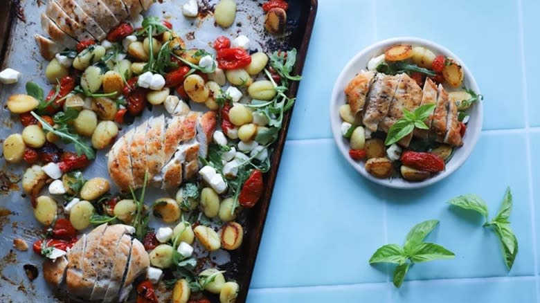 Top-down view of Caprese chicken gnocchi in pan and plate