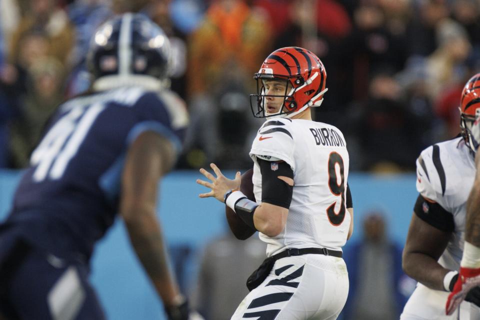 Bengals quarterback Joe Burrow drops back to pass against the Titans on Jan. 22, 2022.