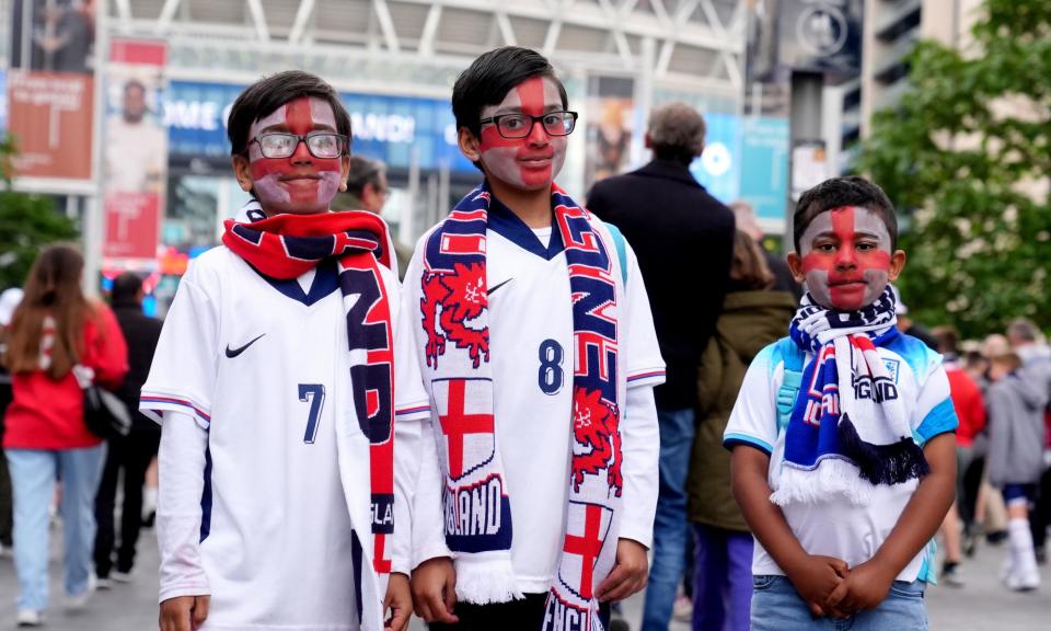 <span>Young England fans outside Wembley before England’s 1-0 defeat to Iceland.</span><span>Photograph: Bradley Collyer/PA</span>