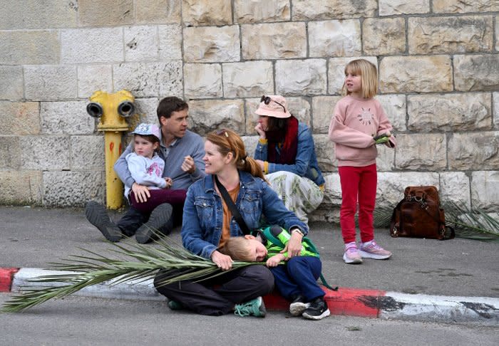 Christians walk in Palm Sunday procession in Jerusalem