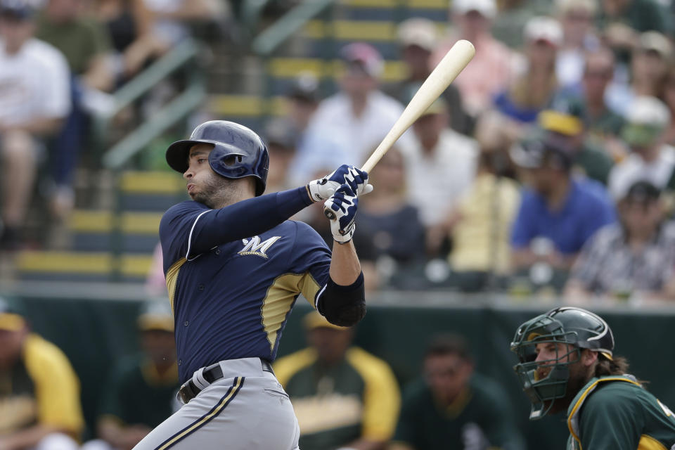 Milwaukee Brewers' Ryan Braun grounds out against the Oakland Athletics during the third inning of a spring training baseball game Thursday, Feb. 27, 2014, in Scottsdale, Ariz. (AP Photo/Gregory Bull)