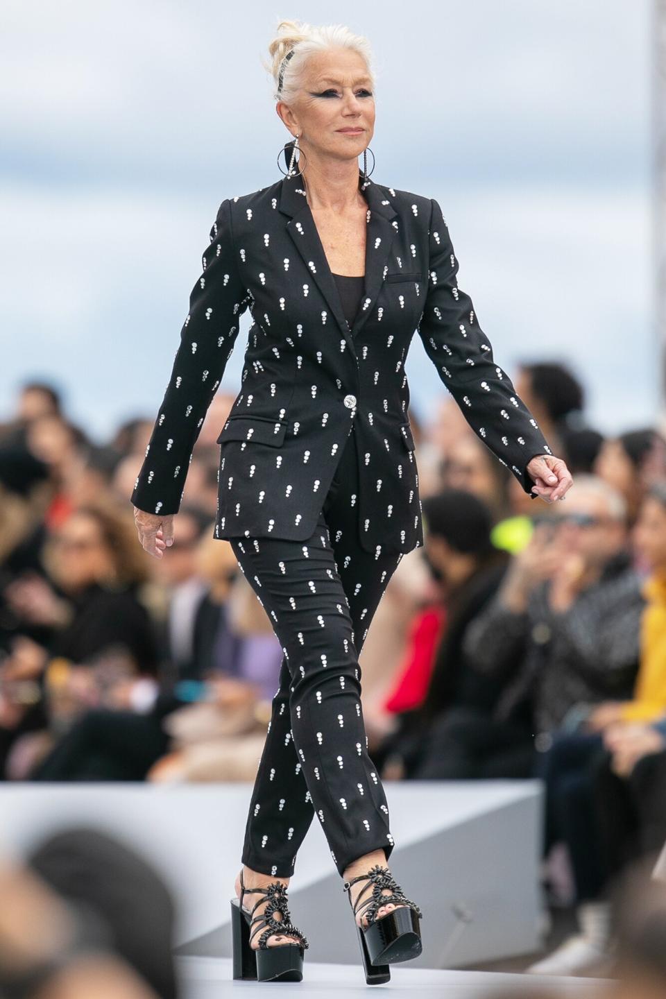 Helen Mirren walks the runway during the "Le Defile L'Oreal Paris 2021" Womenswear Spring/Summer 2022 show as part of Paris Fashion Week on October 03, 2021 in Paris, France.