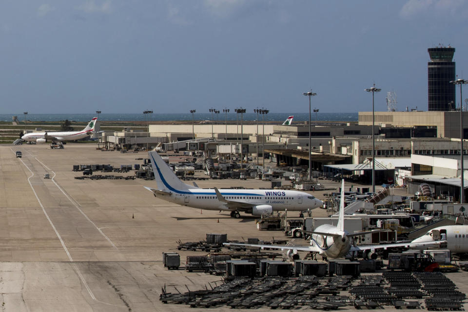 FILE - Planes are grounded due to the coronavirus pandemic at the Rafik Hariri International Airport in Beirut, Lebanon, on March 19, 2020. Lebanon will soon begin the construction of a new terminal at the airport and once it is completed in four years it will be operated by DAA International, an airport company based in Ireland, officials said Monday, March 20, 2023. (AP Photo/Hassan Ammar, File)