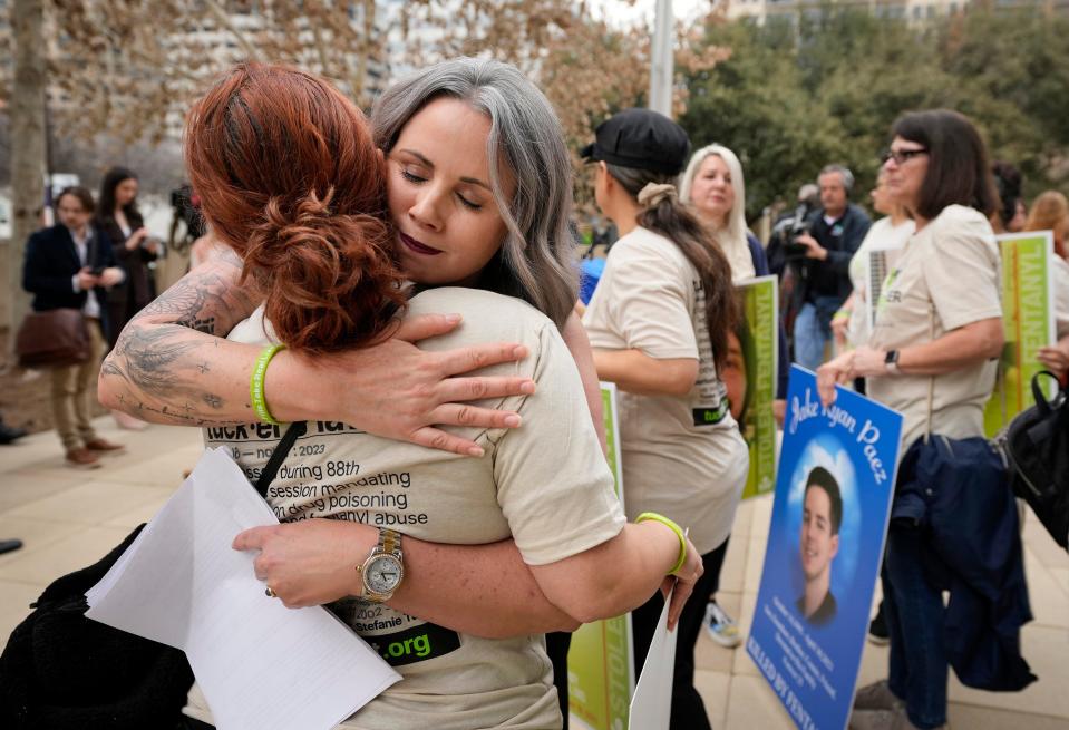 Stefanie Turner, right, mother of Tucker Charles Roe, hugs Martha Ledezma on Friday. Ledezma is the mother of Zarek McMeekin, who died from fentanyl in December.