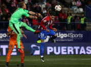 Football Soccer - Atletico Madrid v Eibar - Spanish King's Cup - Vicente Calderon stadium, Madrid, Spain - 19/01/17 - Atletico Madrid's Jose Maria Gimenez and Eibar's goalkeeper Yoel Rodriguez in action. REUTERS/Sergio Perez