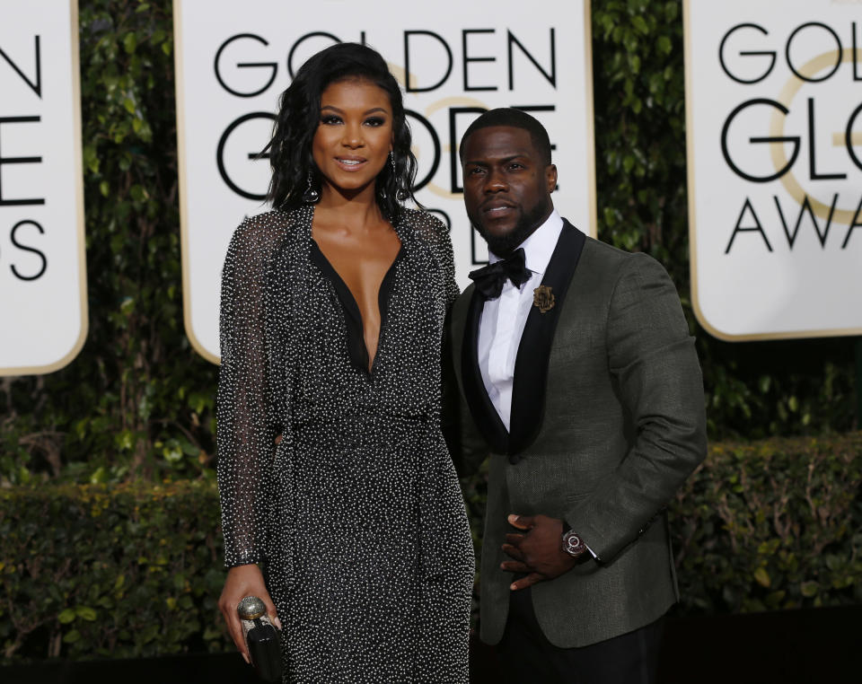 Actor Kevin Hart arrives with Eniko Parrish at the 73rd Golden Globe Awards in Beverly Hills, California January 10, 2016.  REUTERS/Mario Anzuoni