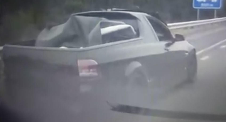 A man has filmed this ute speeding down the M1 believed to be carrying a dead body. Source: 7 News