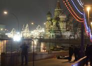 A view shows the covered body of Boris Nemtsov, with St. Basil's Cathedral seen in the background, in central Moscow February 28, 2015. Nemtsov, a Russian opposition politician and former deputy prime minister who was an outspoken critic of President Vladimir Putin, was shot dead metres from the Kremlin in central Moscow late on Friday. (REUTERS/Pavel Bednyakov)