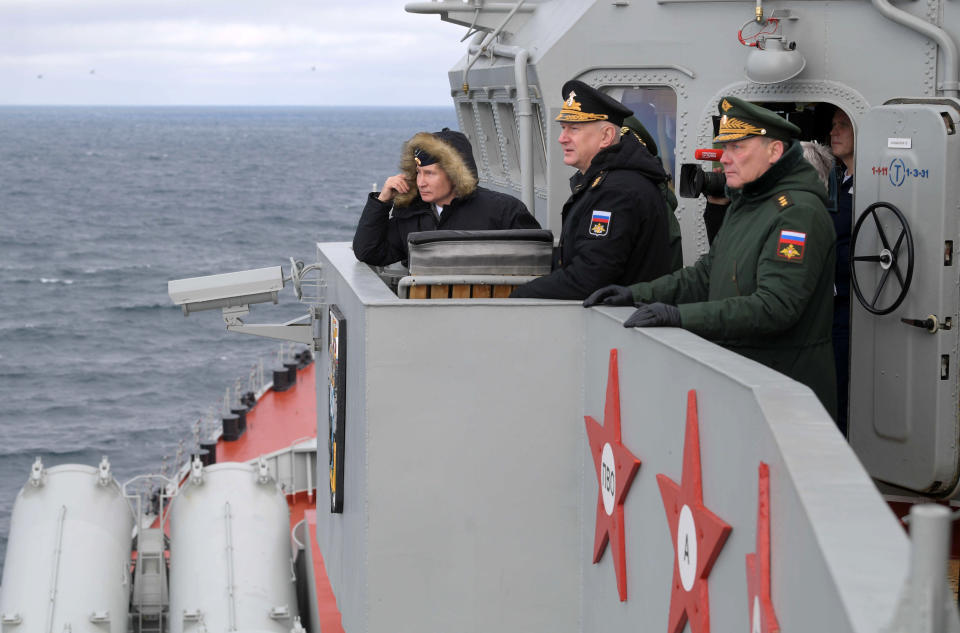 Russian President Vladimir Putin, left, Commander-in-Chief of the Russian Navy Nikolai Yevmenov, second right, and Commander of the Southern Military District troops Alexander Dvornikov, right, watch a navy exercise from the Marshal Ustinov missile cruiser in the Black Sea, Crimea, Thursday, Jan. 9, 2020. The drills involved warships and aircraft that launched missiles at practice targets. (Alexei Druzhinin, Sputnik, Kremlin Pool Photo via AP)