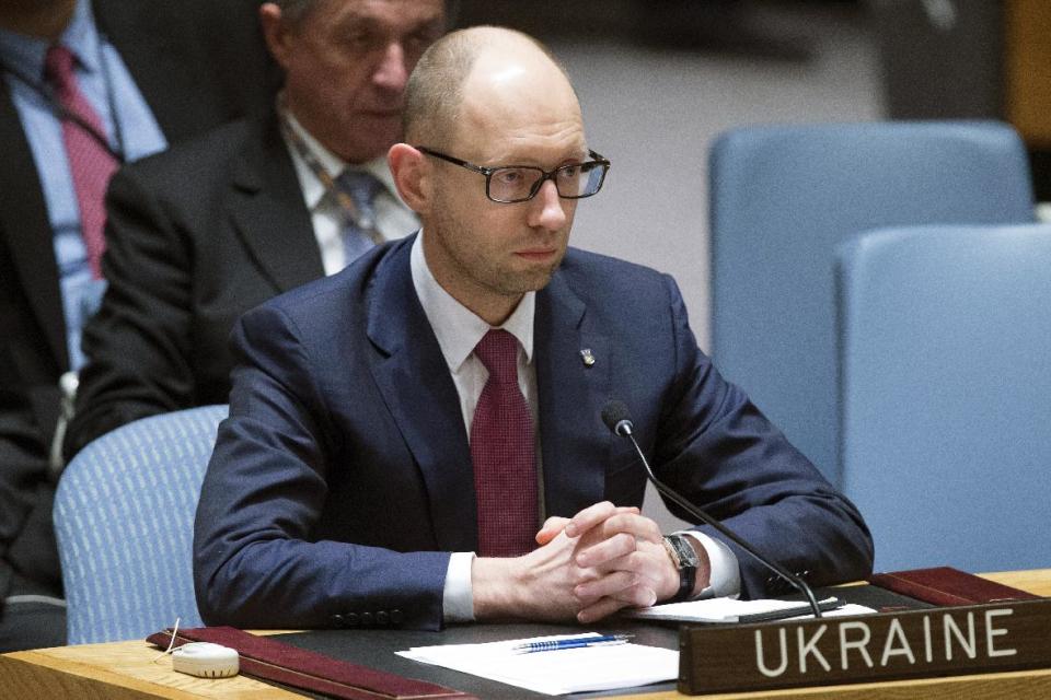 Ukrainian interim Prime Minister Arseniy Yatsenyuk attends an U.N. Security Council meeting on the Ukraine crisis, Thursday, March 13, 2014, at the United Nations Headquarters . Yatsenyuk, during a meeting with President Barack Obama on Wednesday, declared in English that his government was "absolutely ready and open for talks with the Russian Federation" and urged Moscow to "start the dialogue" without guns and tanks. (AP Photo/John Minchillo)